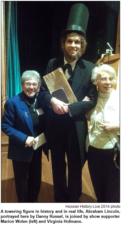A towering figure in history and in real life, Abraham Lincoln, portrayed here by Danny Russel, is joined by show supporter Marion Wolen (left) and Virginia Hofmann. Hoosier History Live photo.