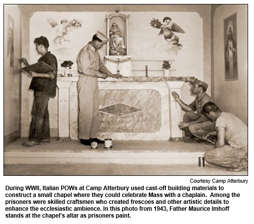 During WWII, Italian POWs at Camp Atterbury used cast-off building materials to construct a small chapel where they could celebrate Mass with a chaplain.  Among the prisoners were skilled craftsmen who created frescoes and other artistic details to enhance the ecclesiastic ambience.  In this photo from 1943, Father Maurice Imhoff stands at the chapel's altar as prisoners paint.  Photo courtesy Camp Atterbury.

