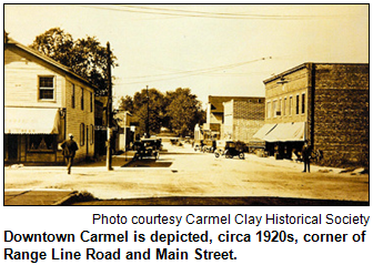 Looking west on Main Street in downtown Carmel after the 1913 fire, circa 1920s. Range Line Road crosses in front of the white general merchandise store on the left. Courtesy Carmel Clay Historical Society.