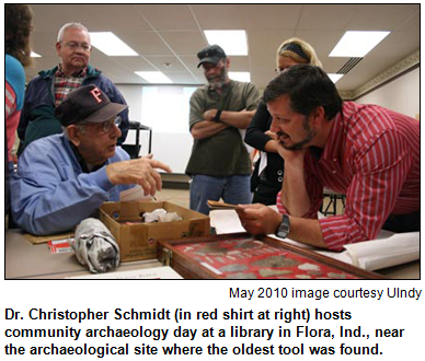 Dr. Christopher Schmidt (in red shirt at right) hosts community archaeology day at a library in Flora, Ind., near the archaeological site where the oldest tool was found.