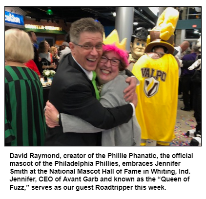 David Raymond, creator of the Phillie Phanatic, the official mascot of the Philadelphia Phillies, embraces Jennifer Smith at the National Mascot Hall of Fame in Whiting, Ind. Jennifer, CEO of Avant Garb and known as the “Queen of Fuzz,” serves as our guest Roadtripper this week.