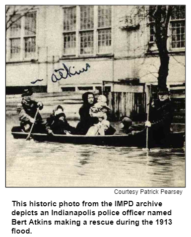 This historic photo from the IMPD archive depicts an Indianapolis police officer named Bert Atkins making a rescue during the 1913 flood. Courtesy Patrick Pearsey.