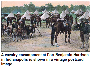 A cavalry encampment at Fort Benjamin Harrison in Indianapolis is shown in a vintage postcard image.