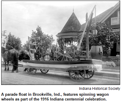 A parade float in Brookville, Ind., features spinning wagon wheels as part of the 1916 Indiana centennial celebration. Image courtesy Indiana Historical Society.