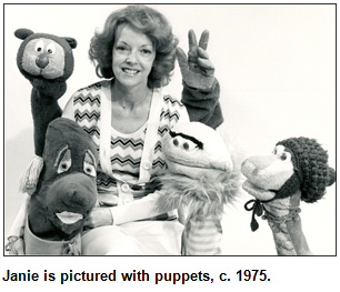 Janie is pictured with puppets, circa 1975.