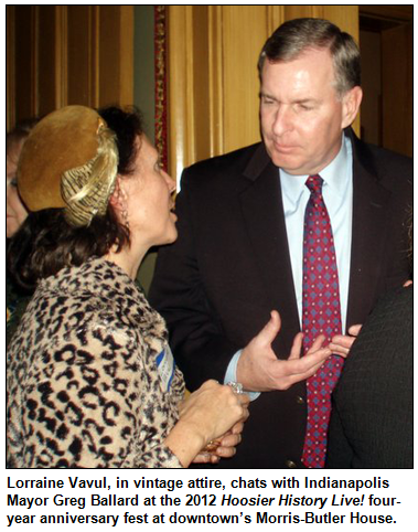 Lorraine Vavul, in vintage attire, chats with Indianapolis Mayor Greg Ballard at the 2012 Hoosier History Live! four-year anniversary fest at downtown�s Morris-Butler House.