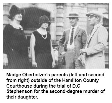 Madge Oberholzer's parents (left and second from right) outside of the Hamilton County Courthouse during the trial of D.C Stephenson for the second-degree murder of their daughter.
