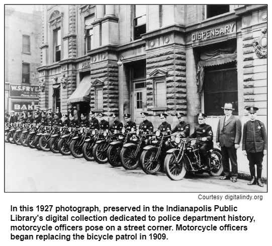 In this 1927 photograph, preserved in the Indianapolis Public Library's digital collection dedicated to police department history, motorcycle officers pose on a street corner. Motorcycle officers began replacing the bicycle patrol in 1909.
