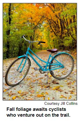 Fall foliage awaits cyclists who venture out on the trail.