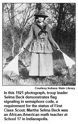 In this 1921 photograph, troop leader Selma Beck demonstrates flag signaling in semaphore code, a requirement for the status of First Class Scout. Martha Selma Beck was an African-American math teacher at School 17 in Indianapolis.
Courtesy Indiana State Library.