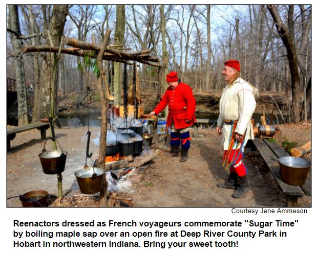Reenactors dressed as French voyageurs commemorate "Sugar Time" by boiling maple sap over an open fire at Deep River County Park in Hobart in northwestern Indiana. Bring your sweet tooth! Courtesy Jame Ammeson.