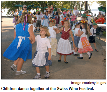 Children dance together at the Swiss Wine Festival. Image courtesy in.gov.