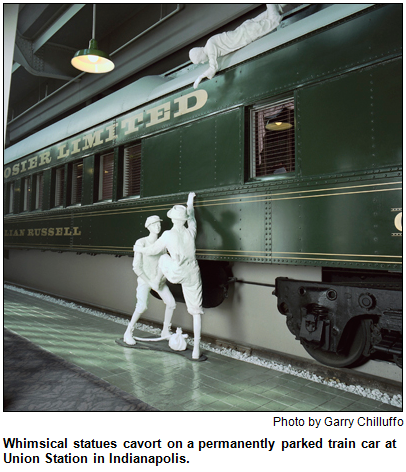 Whimsical statues cavort on a permanently parked train car at Union Station in Indianapolis. Photo by Garry Chilluffo.