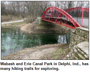 Wabash and Erie Canal Park in Delphi, Ind., has many hiking trails for exploring. Pictured is a red bridge.