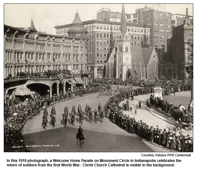 In this 1919 photograph, a Welcome Home Parade on Monument Circle in Indianapolis celebrates the return of soldiers from the first World War.  Christ Church Cathedral is visible in the background.  
Courtesy Indiana WWI Centennial.