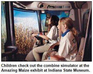 Children check out the combine simulator at the Amazing Maize exhibit at Indiana State Museum.