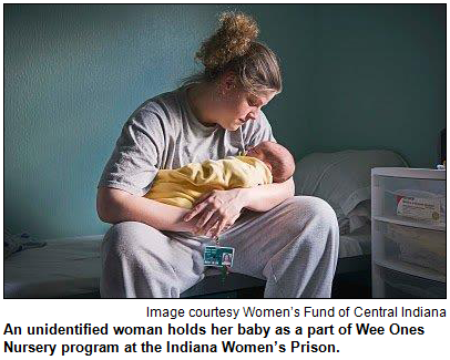 An unidentified woman holds her baby as a part of Wee Ones Nursery program at the Indiana Women’s Prison. Image courtesy Women’s Fund of Central Indiana.