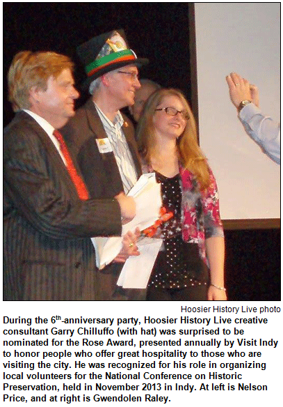 During the 6th-anniversary party, Hoosier History Live creative consultant Garry Chilluffo (with hat) was surprised to be nominated for the Rose Award, presented annually by Visit Indy to honor people who offer great hospitality to those who are visiting the city. He was recognized for his role in organizing local volunteers for the National Conference on Historic Preservation, held in November 2013 in Indy. At left is Nelson Price, and at right is Gwendolen Raley. Hoosier History Live photo.