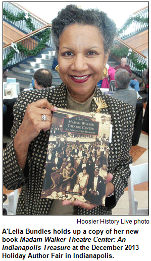 A'Lelia Bundles holds up a copy of her new book Madam Walker Theatre Center: An Indianapolis Treasure at the December 2013 Holiday Author Fair in Indianapolis. Hoosier History Live photo.