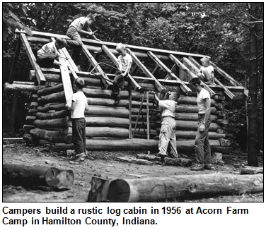 Campers build a rustic log cabin in 1956 at Acorn Farm Camp in Hamilton County, Indiana.