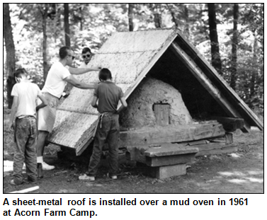 A sheet-metal roof is installed over a mud oven in 1961 at Acorn Farm Camp.