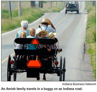 An Amish family travels in a buggy on an Indiana road. Image courtesy Indiana Business Network.