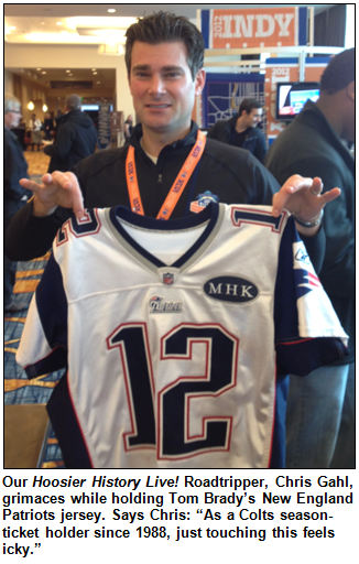 Chris Gahl grimaces while holding a Tom Brady jersey.