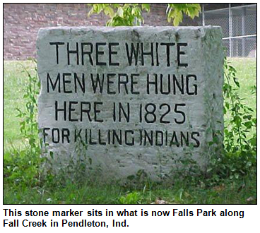 This stone marker, commemorating the Fall Creek Massacre, sits in what is now Falls Park along Fall Creek in Pendleton, Ind. The text on the marker reads, "Three white men were hung here in 1825 for killing Indians."