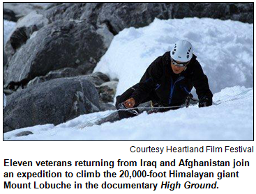 Man climbing mountain with snow and rocks around him. Eleven veterans returning from Iraq and Afghanistan join an expedition to climb the 20,000-foot Himalayan giant Mount Lobuche in the documentary High Ground. Courtesy Heartland Film Festival.