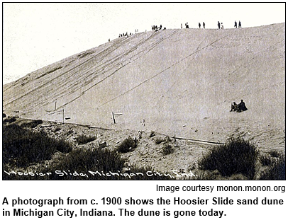 A photograph from circa 1900 shows the Hoosier Slide sand dune in Michigan City, Indiana. The dune is gone today. Image courtesy monon.monon.org.