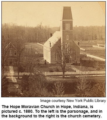 The Hope Moravian Church in Hope, Indiana, is pictured c. 1880. To the left is the parsonage, and in the background to the right is the church cemetery. Image courtesy New York Public Library.