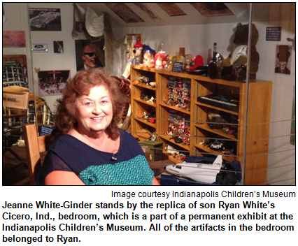 Jeanne White-Ginder stands by the replica of son Ryan White’s Cicero, Ind., bedroom, which is a part of a permanent exhibit at the Indianapolis Children’s Museum. All of the artifacts in the bedroom belonged to Ryan. Image courtesy Indianapolis Children's Museum.