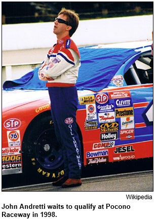 John Andretti stands beside his car and waits to qualify at a NASCAR race at Pocono Raceway in 1998. Image courtesy Wikipedia.