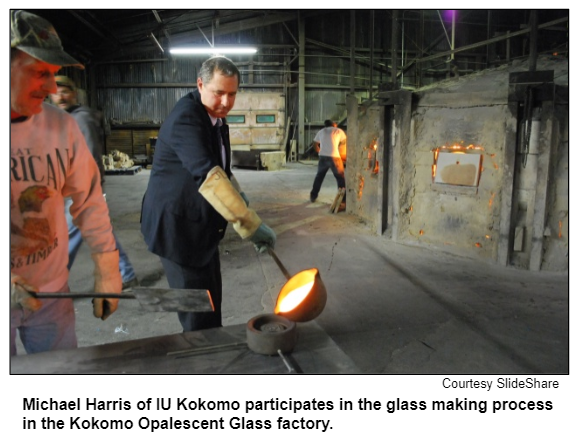 Michael Harris of IU Kokomo participates in the glass making process in the Kokomo Opalescent Glass factory.