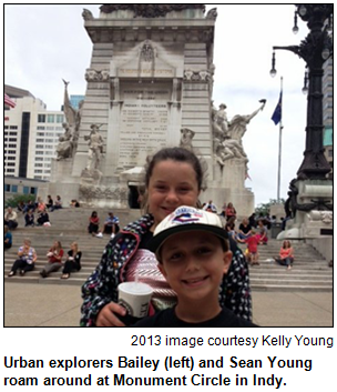Urban explorers Bailey (left) and Sean Young roam around at Monument Circle in Indy. Image courtesy Kelly Young.
