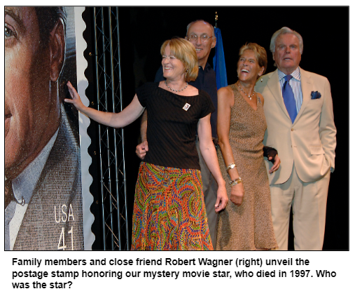 Family members and close friend Robert Wagner (right) unveil the postage stamp honoring our mystery movie star, who died in 1997. Who was the star?