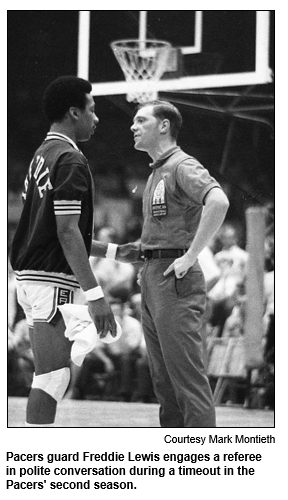 Pacers guard Freddie Lewis engages a referee in polite conversation during a timeout in the Pacers' second season.
Courtesy Mark Montieth.