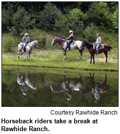 Horseback riders take a break at Rawhide Ranch.