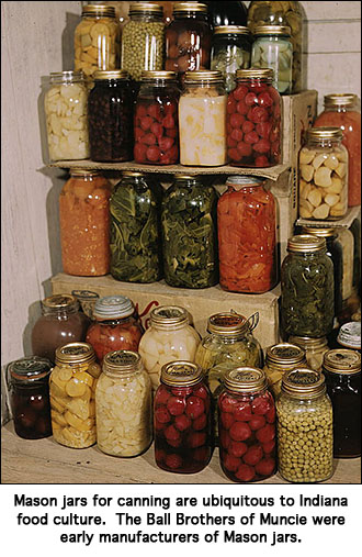 Canned food on shelves in Mason jars.