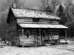Log cabin in the snow.